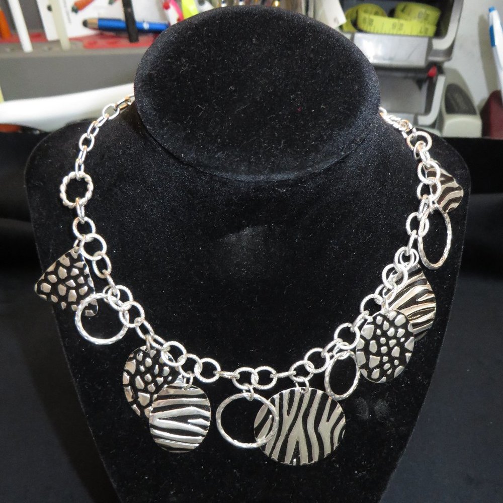 Silver and black toned circles & bangles necklace